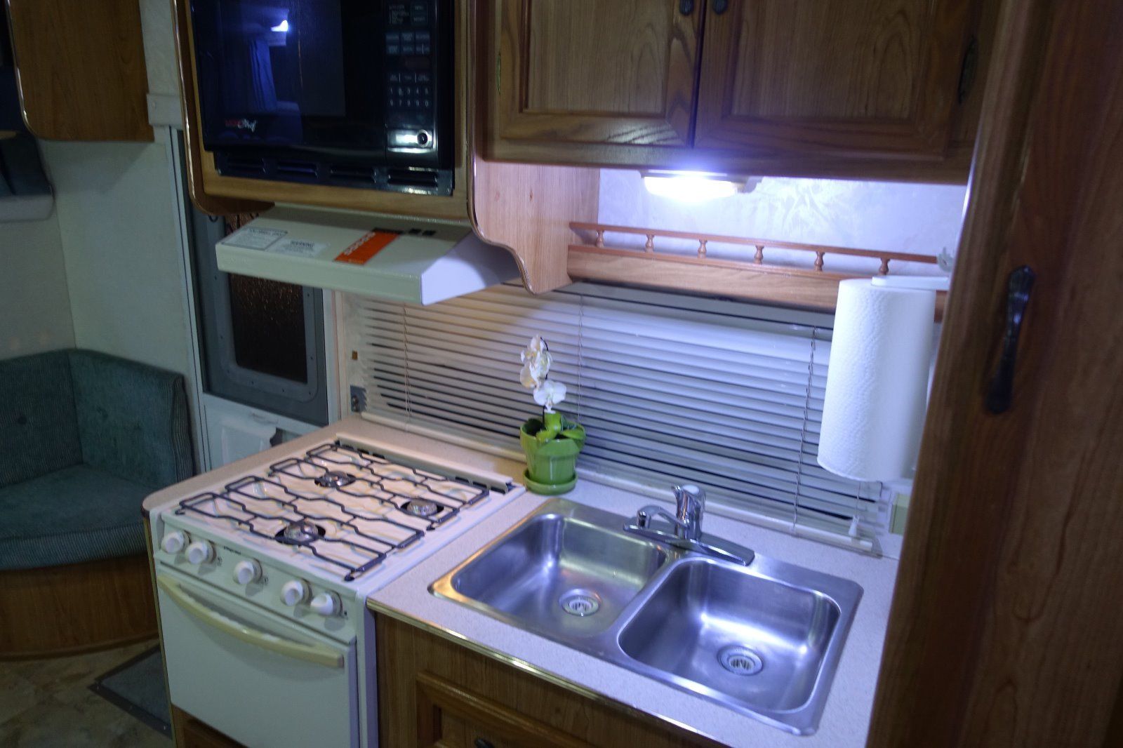 Galley with propane stove, oven and double stainless sink