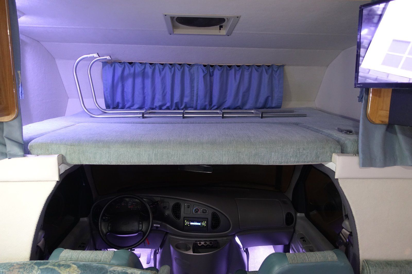 Overhead cab bunk above the cockpit